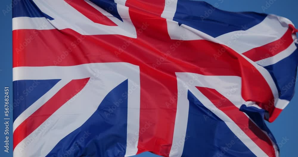 The national British flag waving in the wind. The national British flag waving in the wind.