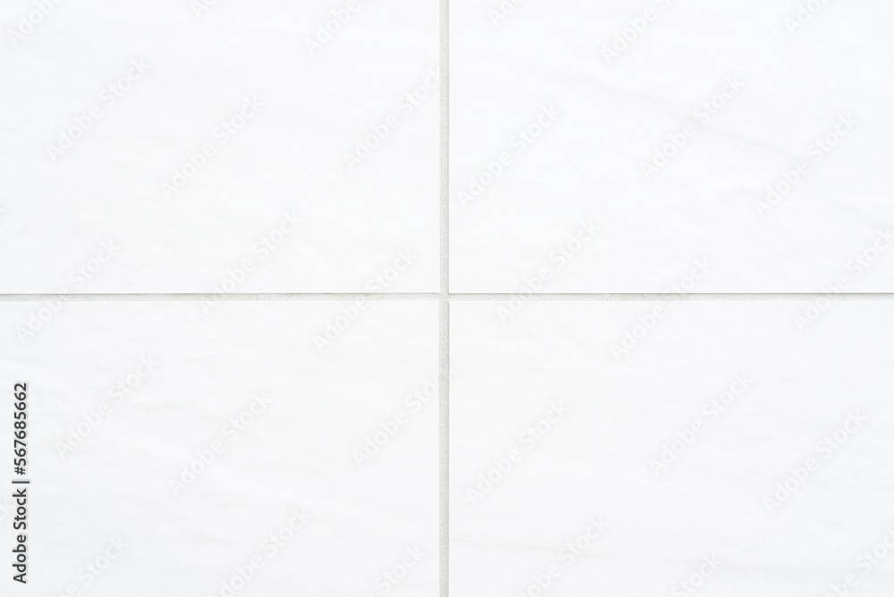 The texture of the tile is white. White background with tile texture The texture of the tile is white. White background with tile texture