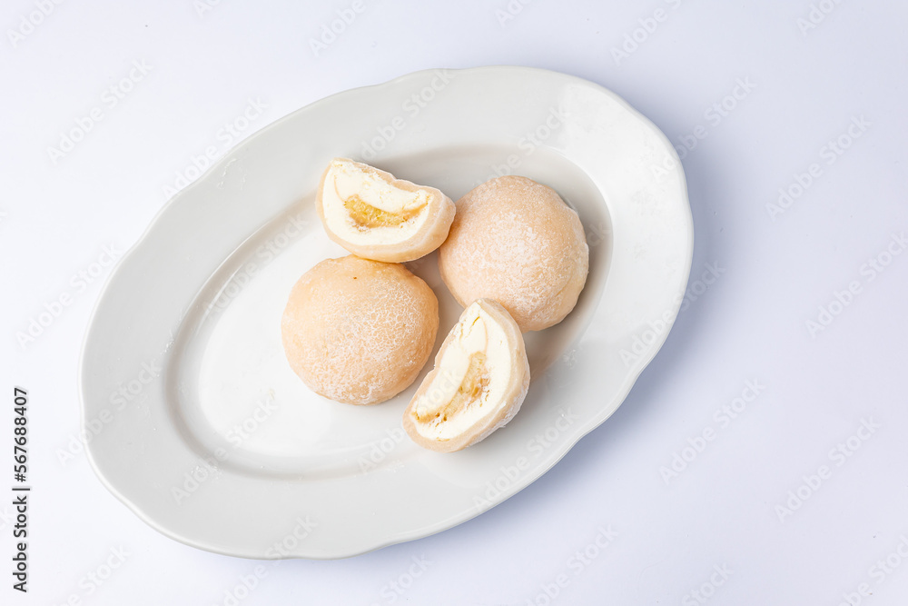 Delicious mochi on a white background, close-up. Traditional Japanese dessert
Delicious mochi on a white background, close-up. Traditional Japanese dessert