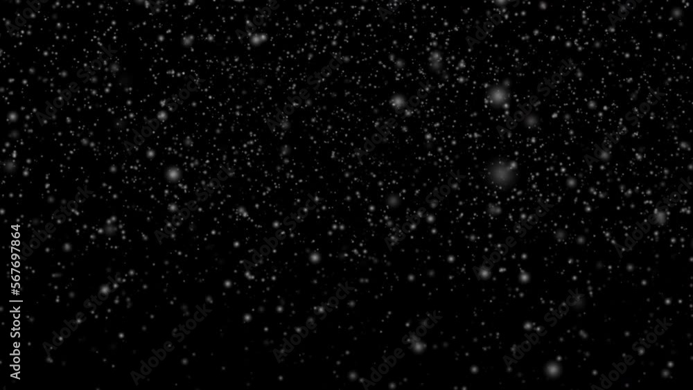 Many white snowflakes falling down on a black background Many white snowflakes falling down on a black background
