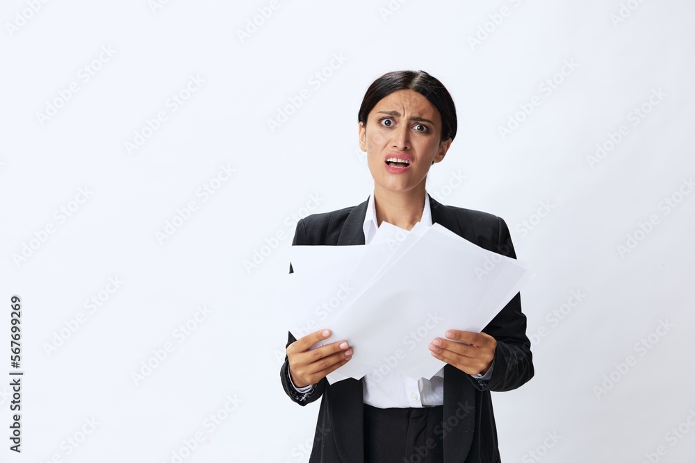 Business woman throwing papers documents in black business suit showing signals gestures and emotions on white background, freelancer job online time management Business woman throwing papers documents in black business suit showing signals gestures and emotions on white background, freelancer job online time management