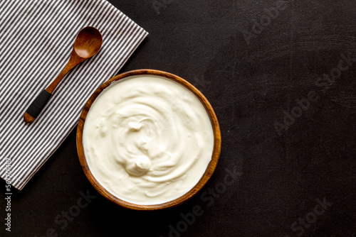 Dairy product - sour cream or yogurt in wooden bowl