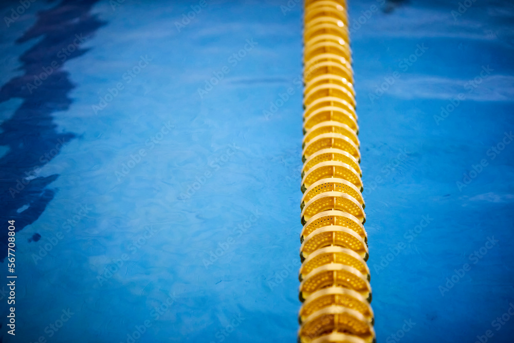 Yellow Pool Bottom yellow buoys in the indoor pool. yellow dividing paths in the pool for ...