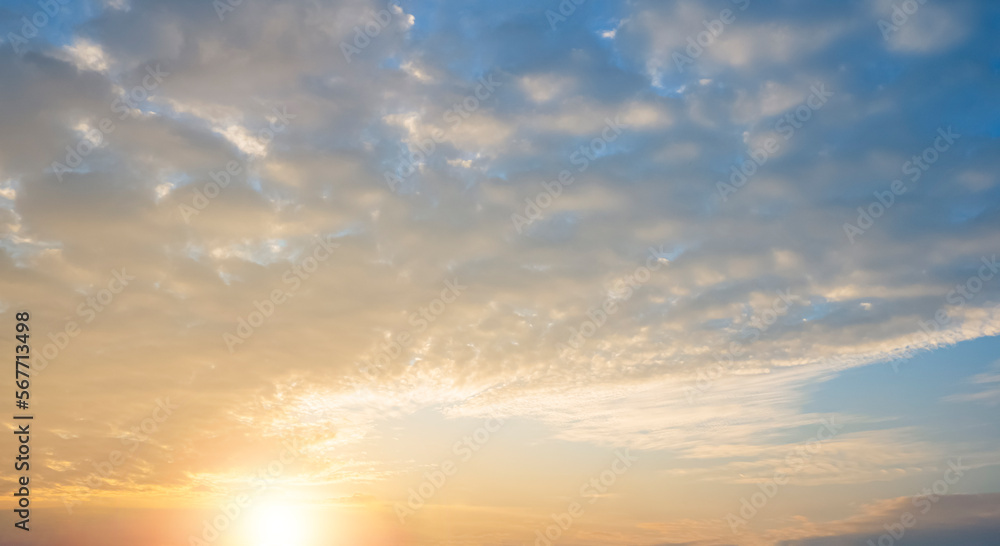 Sunset Sky background with beautiful Yellow sunlight and white cloudy in summer season