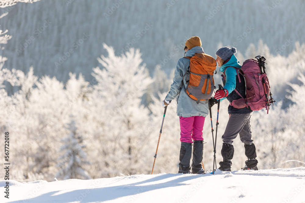 Two women in the winter trekking