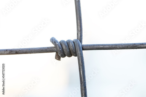 Steel wire fence from the grid with silver polymer coating. Tensile Mesh knotted wire mesh rust-resistant barbed, thick zinc plated. Can withstand tensile strength able to receive impact.