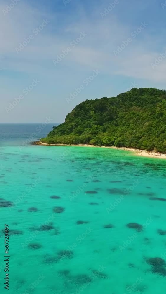 Aerial view of beauty nature landscape with beach, corals and sea on tropical Koh Rok island, Thailand. Vertical video Aerial view of beauty nature landscape with beach, corals and sea on tropical Koh Rok island, Thailand. Vertical video