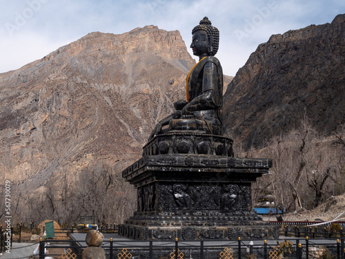 Muktinath temple, Annapurna Circuit trek. 35 feet carved stone Buddha located in the temple complex.
