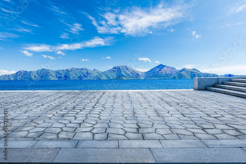 Empty square floor and lake with mountain natural background