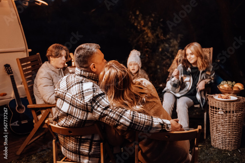 Wallpaper Mural Family trailer travel. Children,brother sister,mom dad fry sausages on fire, eat hot dogs. Evening picnic in nature.Holiday barbecue BBQ food.Vacation weekend dinner.Road lunch.Camper,house on wheels Torontodigital.ca