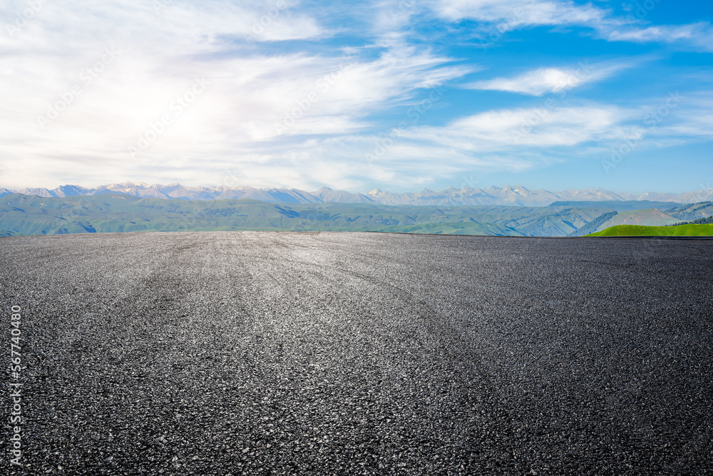 Fototapeta premium Asphalt road with green mountain nature background