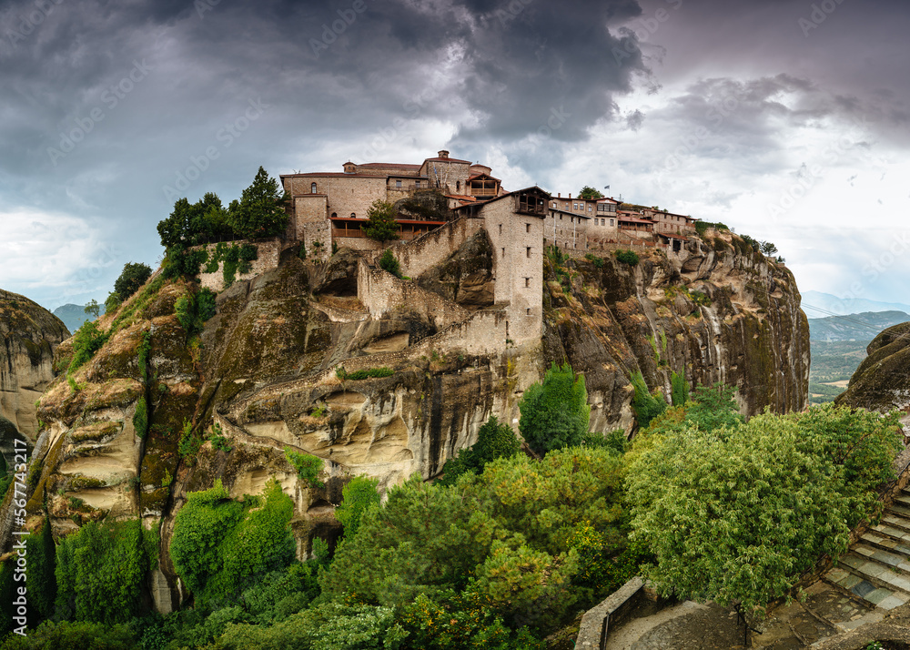 Amazing panoramic landscape of monastery on a rock. The Monastery of Great Meteoron is an Eastern Orthodox monastery. Meteora monastery complex. Thessaly. Greece. UNESCO World Heritage List.