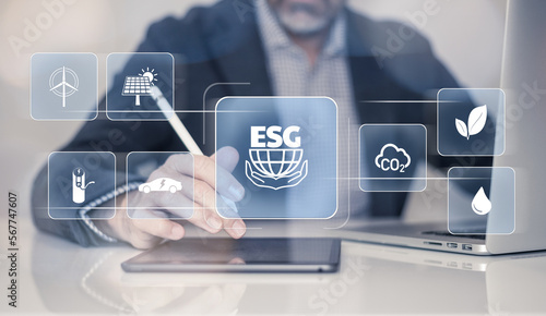 Businessman using tablet computer. ESG environmental social governance concept. Business strategy