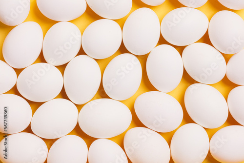 White eggs on yellow background