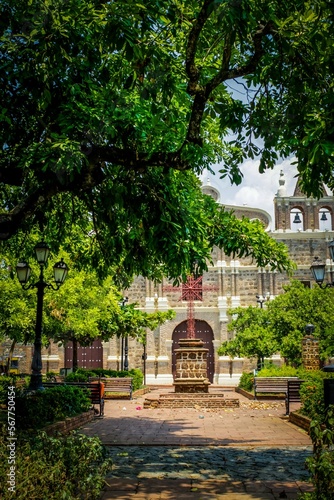 church in the middle of the park of a colonial town