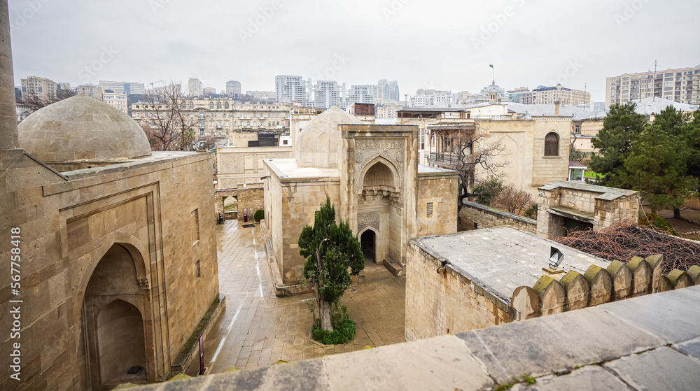 The old town of Baku city center during a cloudy raining day. Travel to Azerbaijan. Fortress architecture buildings.
