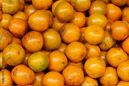 Orange fruit in the market. Orange background. Orange background. Orange background