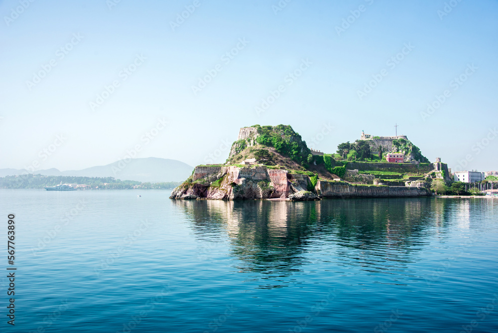 View of the fortress of Corfu from the sea in the morning mist with a steamer in the distance, Greece. Harmony, popular tourist attractions. amazing places.
