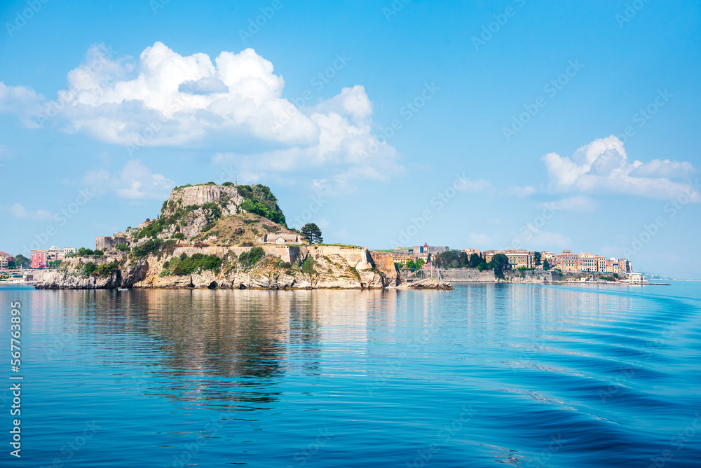 View of the fortress of Corfu from the sea in the morning mist with a trace of waves from the ferry. popular tourist attractions. amazing places.