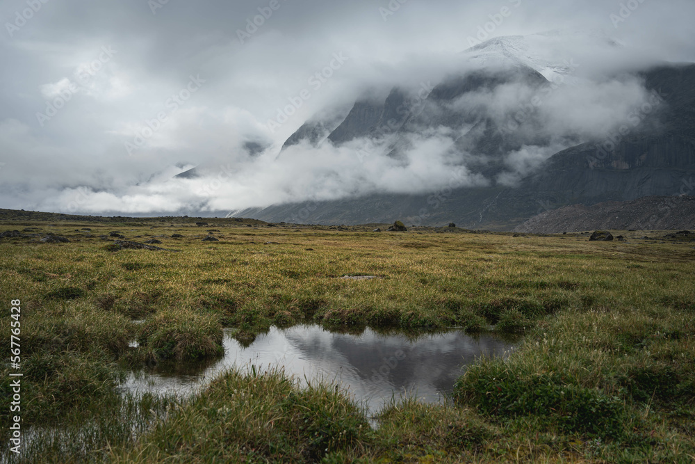 Panoramic landscape view of Akshayuk Pass, Auyuittuq National Park landscape view. Baffin Mountains Panoramic landscape view of Akshayuk Pass, Auyuittuq National Park landscape view. Baffin Mountains