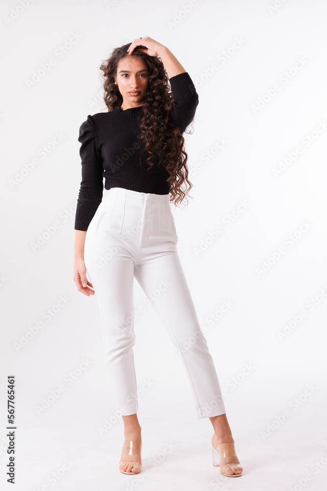 Fototapeta premium photo session of a young brunette model in photo studio on white background