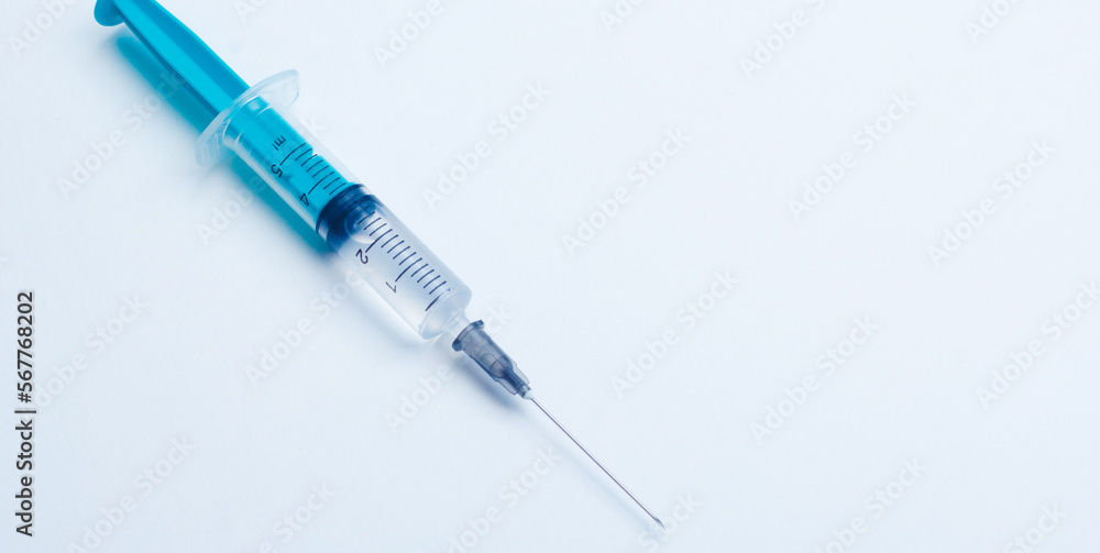 Disposable plastic syringe prepared for injection and vaccination in the hospital. The concept of medicine and health Disposable plastic syringe prepared for injection and vaccination in the hospital. The concept of medicine and health