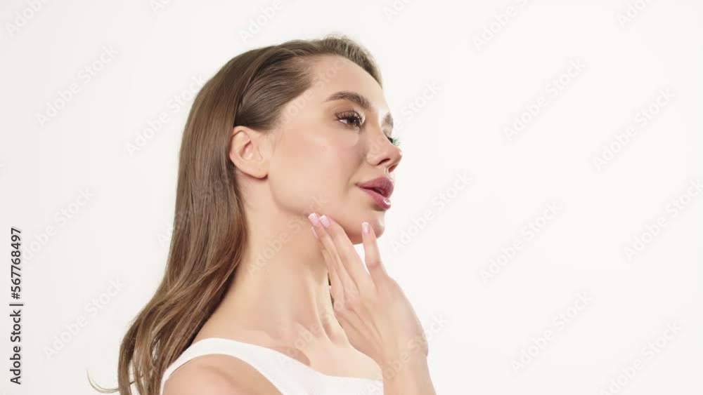 Skincare concept. Close-up beauty portrait of young woman with touching her smooth and healthy skin Skincare concept. Close-up beauty portrait of young woman with touching her smooth and healthy skin