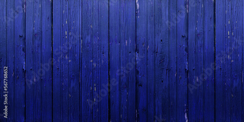 Soft grasient on vintage vertical wooden shabby deepblue colored background, texture, part of rustic wall