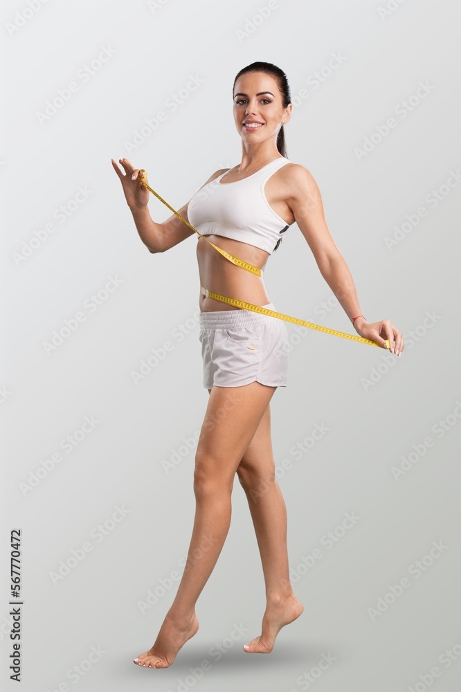 Fitness young woman posing on background Fitness young woman posing on background