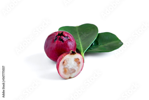 Red Cattley guava fruit and leaves on white background (Psidium cattleyanum)