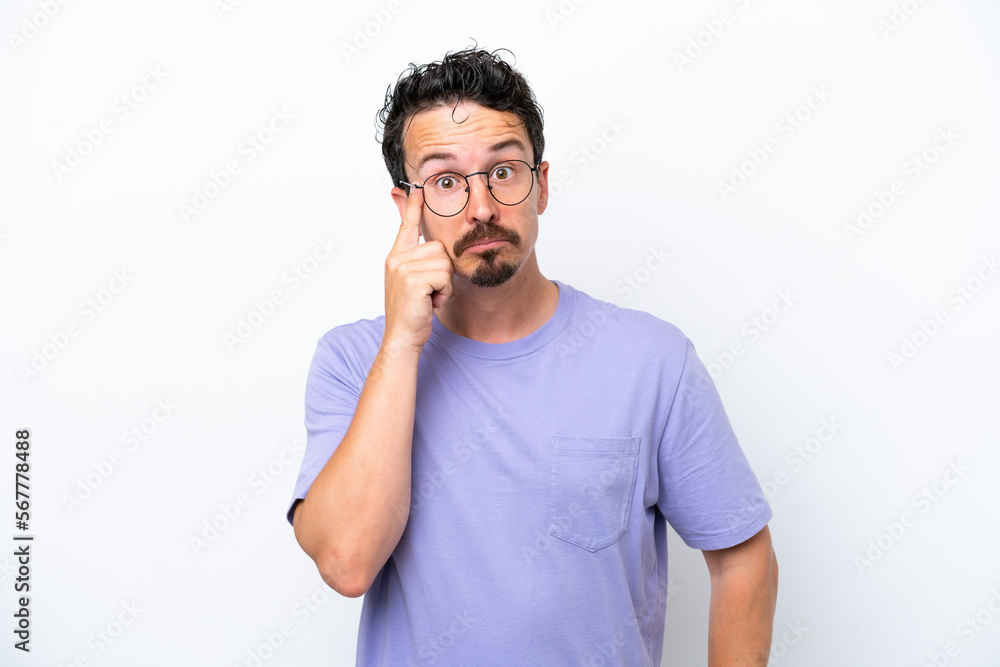 Young man with moustache isolated on white background thinking an idea Young man with moustache isolated on white background thinking an idea