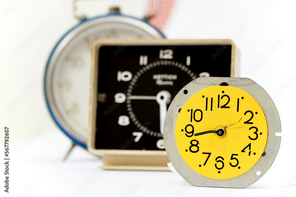 three retro alarm clocks on isolated background three retro alarm clocks on isolated background
