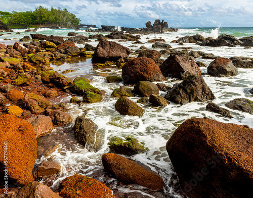 Waves Washing Over The Red Rocks Of Koki Beach at Koki Beach Park, Hana, Maui, Hawaii, USA photo