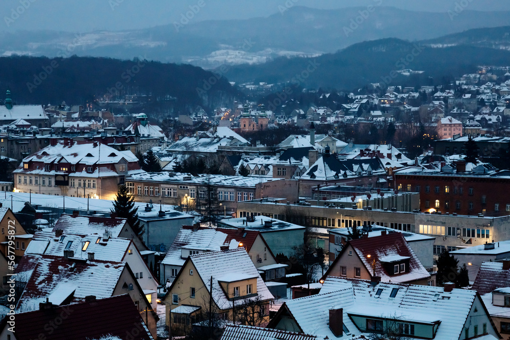 Snow-covered town at night from above, winter city