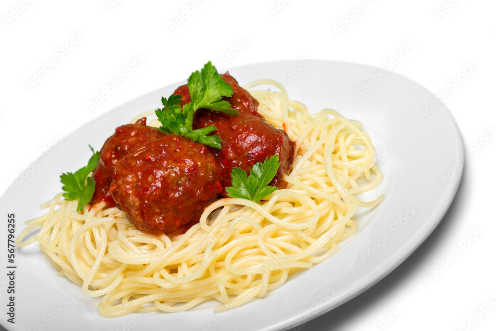 Spaghetti pasta with tomatoes and parsley on plate Spaghetti pasta with tomatoes and parsley on plate