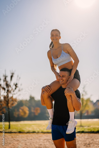 Fitness couple having fun, outdoors, on a sunny day