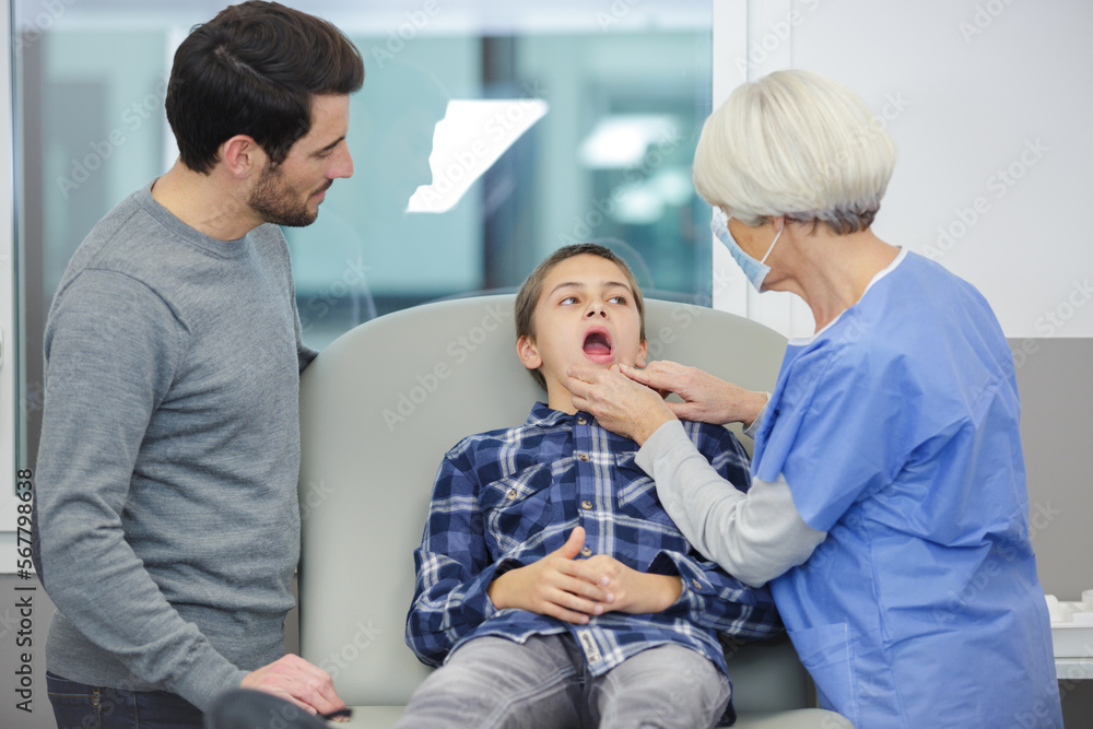 cute little boy and dentist in clinic cute little boy and dentist in clinic