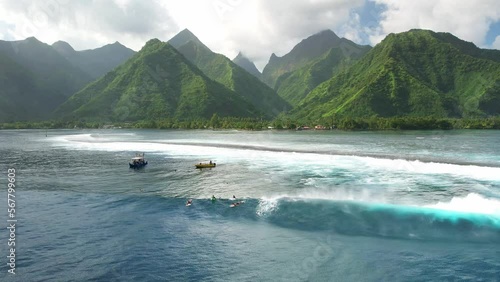 Tahiti drone 4k. Surf boat. Exotic tropical island, waves in ocean lagoon, mountains. Aerial view of French Polynesia. Teahupoo is a famous surfing destination near Papeete. Slow motion. 
