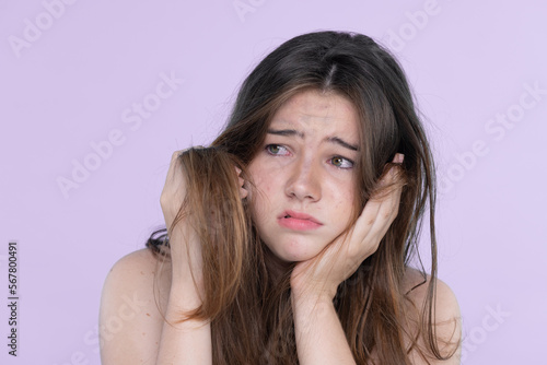 Photos Beautiful girl feel sad, worry about her damaged hair with isolated background