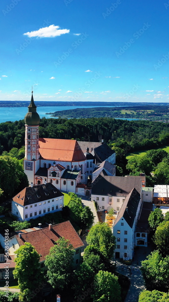 Luftbild vom Kloster Andechs mit Blick auf den Ammersee im Hintergrund. Andechs, Starnberg, Oberbayern, Bayern, Deutschland.