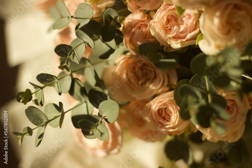 bouquet of flowers on the table with cups of coffee photo