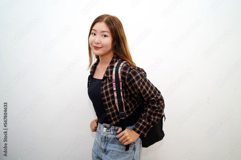 Portrait of smiling young Asian student with backpack isolated white background. Portrait of smiling young Asian student with backpack isolated white background.