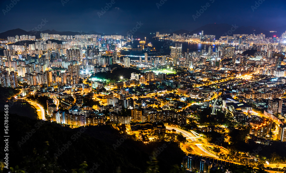 Panorama aerial view of Hong Kong Kowloon's crowded buildings and Victoria Harbour in China.