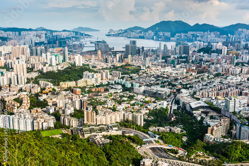 Panorama aerial view of Hong Kong Kowloon's crowded buildings and Victoria Harbour in China.