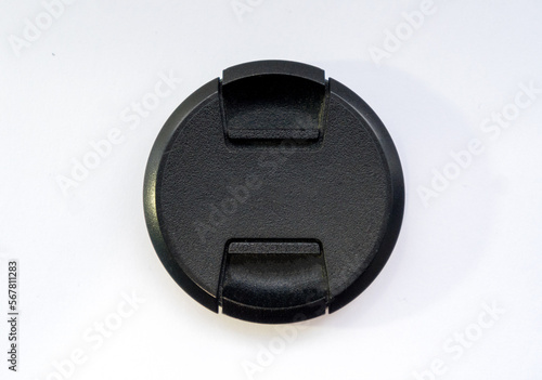 black cap for the lens on a white background. Locks on both sides