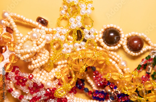 Beads, Jewelery, beads necklace on yellow background. 
