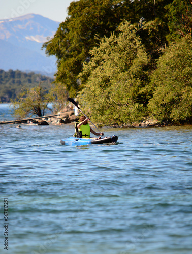 woman kayaking on a lake in patagonia © Lautaro
