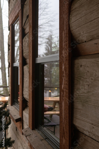 forest reflection in a cabin window
