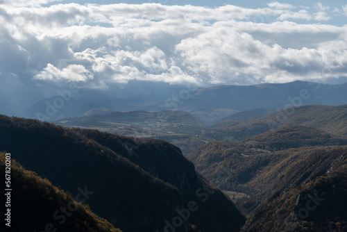 Unac river canyon toward Martin Brod against mountains and big bright clouds in distance, mountian landscape in autumn © slobodan