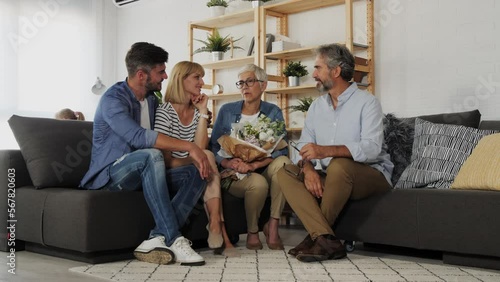 Senior couple visiting with children